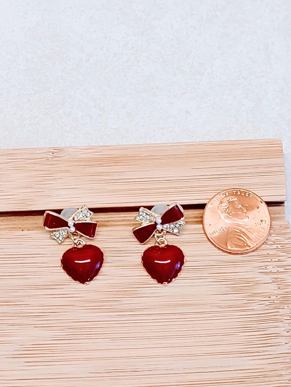RED ENAMEL & BRASS HEART AND BOW EARRINGS WITH CRYSTAL AND FAUX PEARL ACCENTS